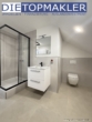 Bad im Obergeschoss - Modernisiertes Einfamilienhaus mit attraktiver Mieteinnahme, großzügigem Garten, Garage & Carport